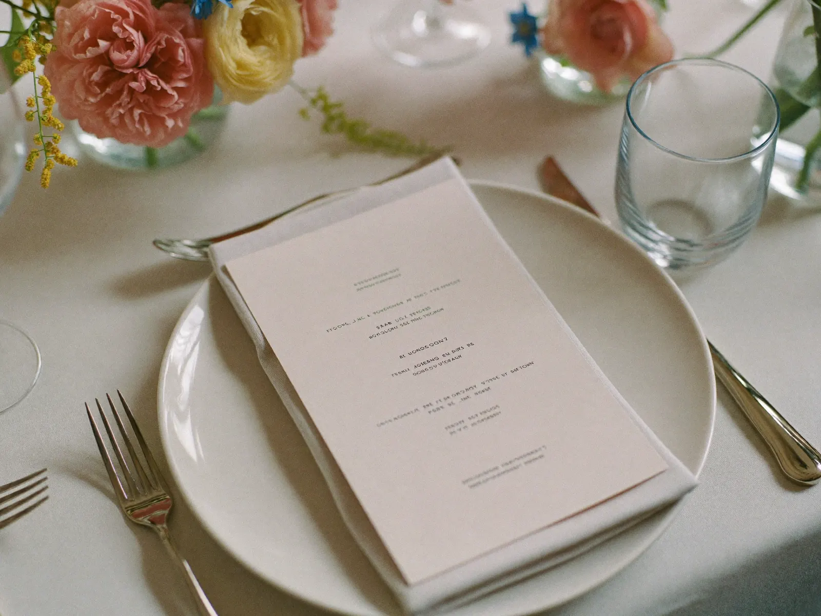 A place setting with a blank menu card