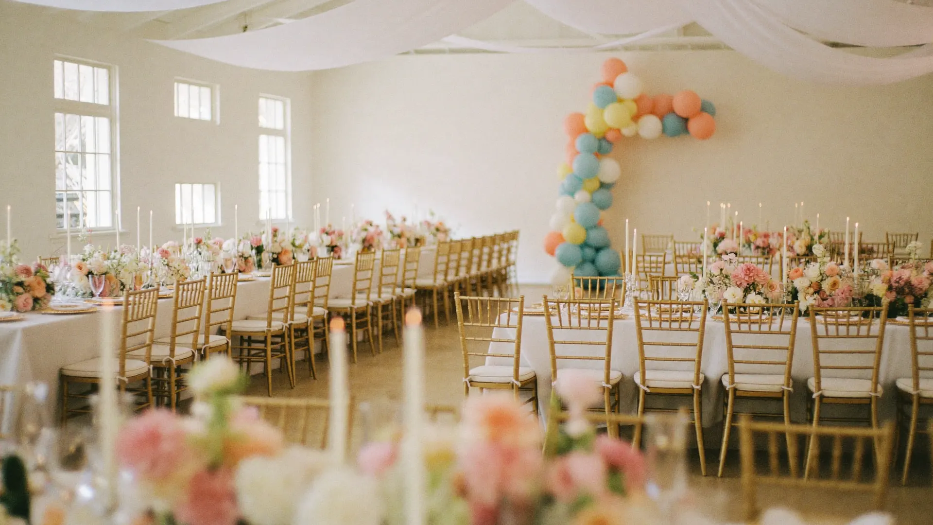 A wide reception hall fully styled for a celebration